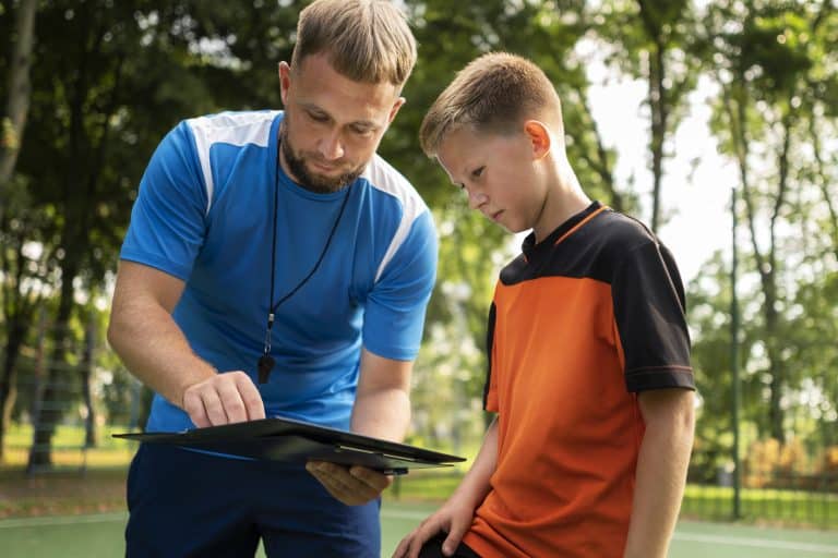 football trainer teaching his pupils
